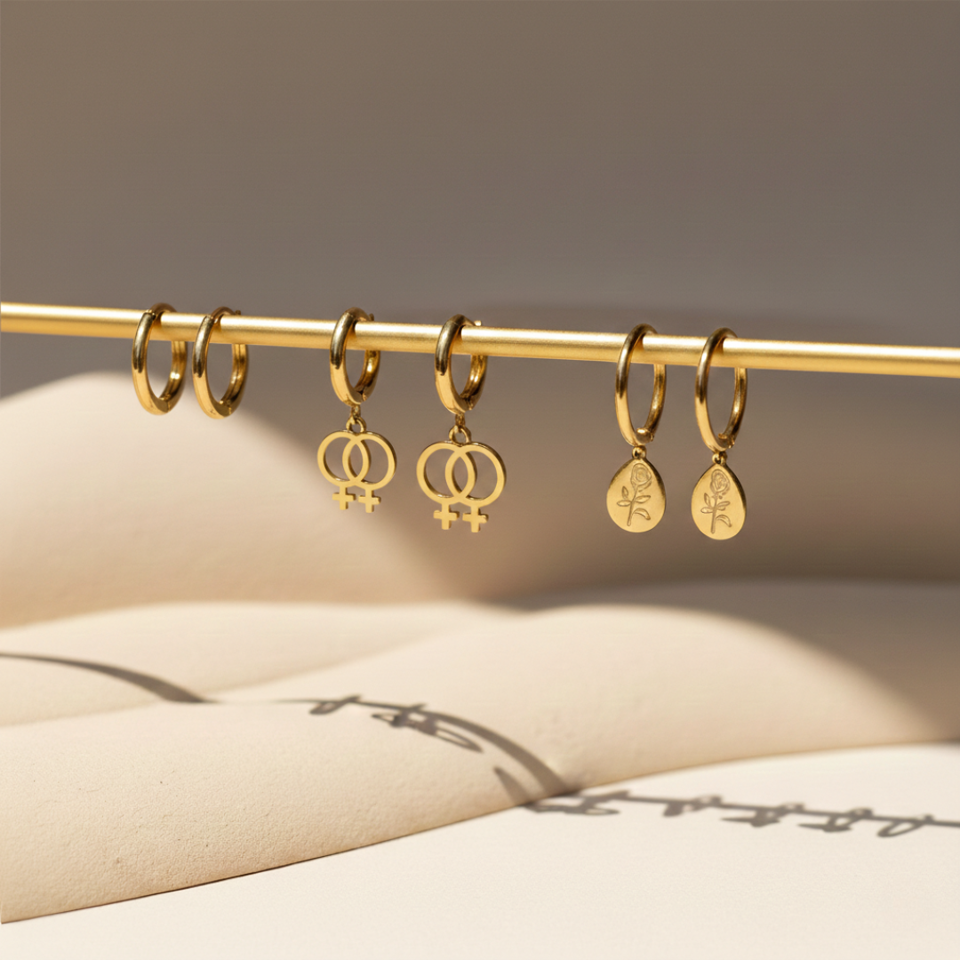 Three pairs of gold Price Stance earrings